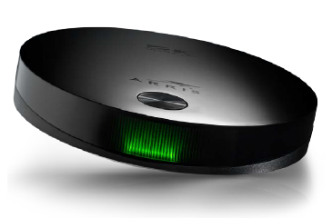 A black circular object with a green light

Description automatically generated