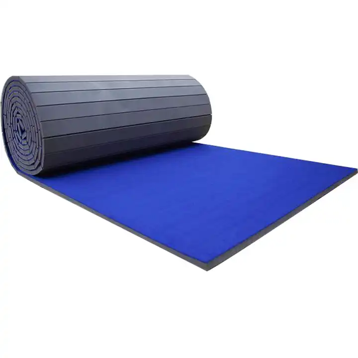 A blue tumbling mat on a white surface