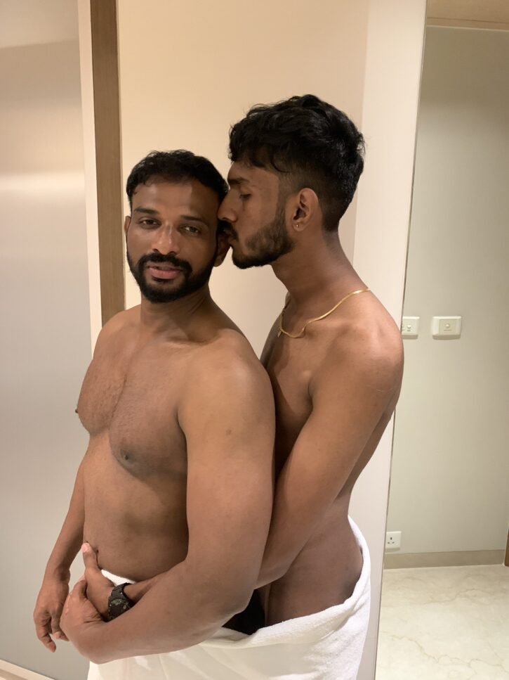 Mr Yuvii  kissing an anonymous hookup on the cheek while holding up a white towel