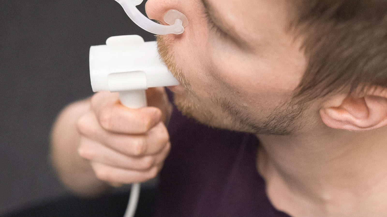 Male patient undergoes spirometry test