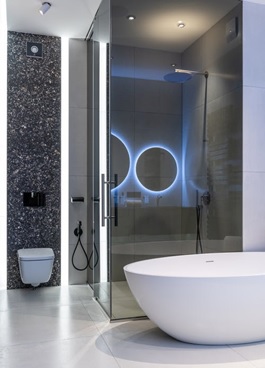 : A modern bathroom with a bathtub and a shower