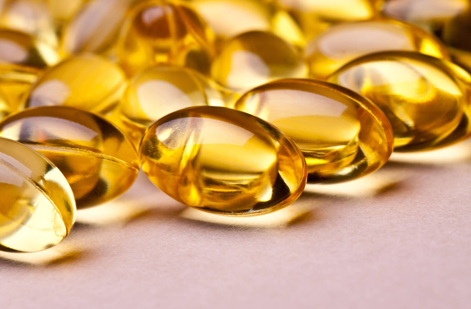 A close-up of a bundle of omega-3 supplements.