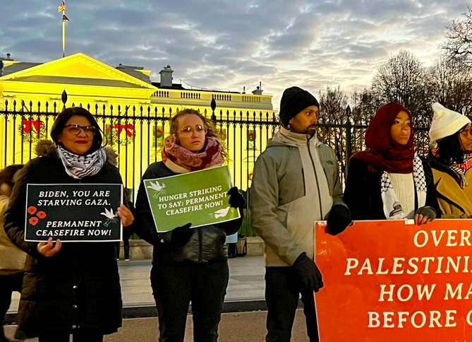 Rashida stands with three protesters outside the White House