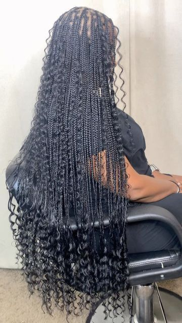 Pretty lady shows off her waist length boho knotless braids 