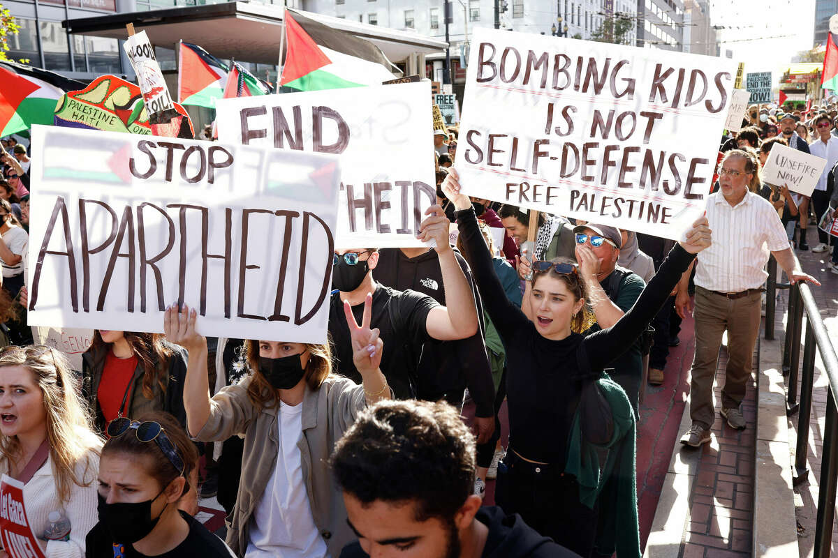 Marchers show their support for Gazans during the “Free Palestine” protest along Market Street in San Francisco.