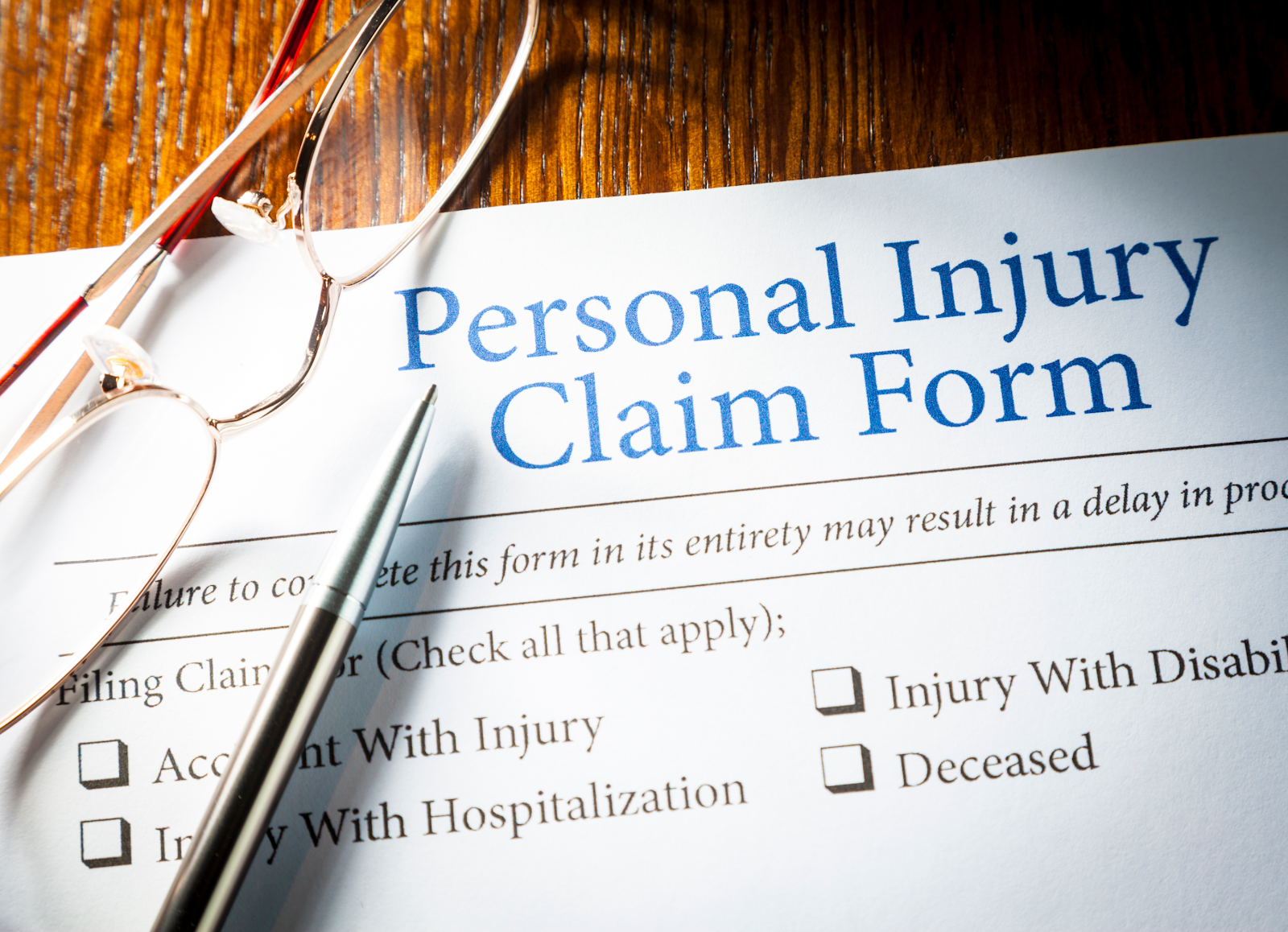personal injury claim form sitting on a table for personal injury attorneys to sign with their clients