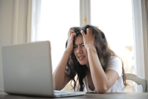 Free Woman in White Shirt Showing Frustration Stock Photo