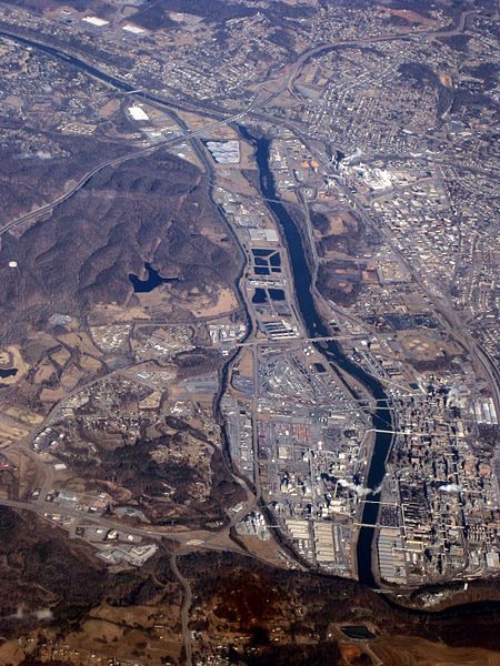 An aerial photo of Kingsport. A cityscape sprawls on a riverside, and the Long Island of the Holston River is at the center of the photo. 