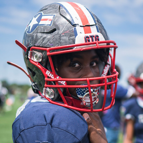 Young male football player wearing Battle Sports Football American Flag Binky Mouthguard