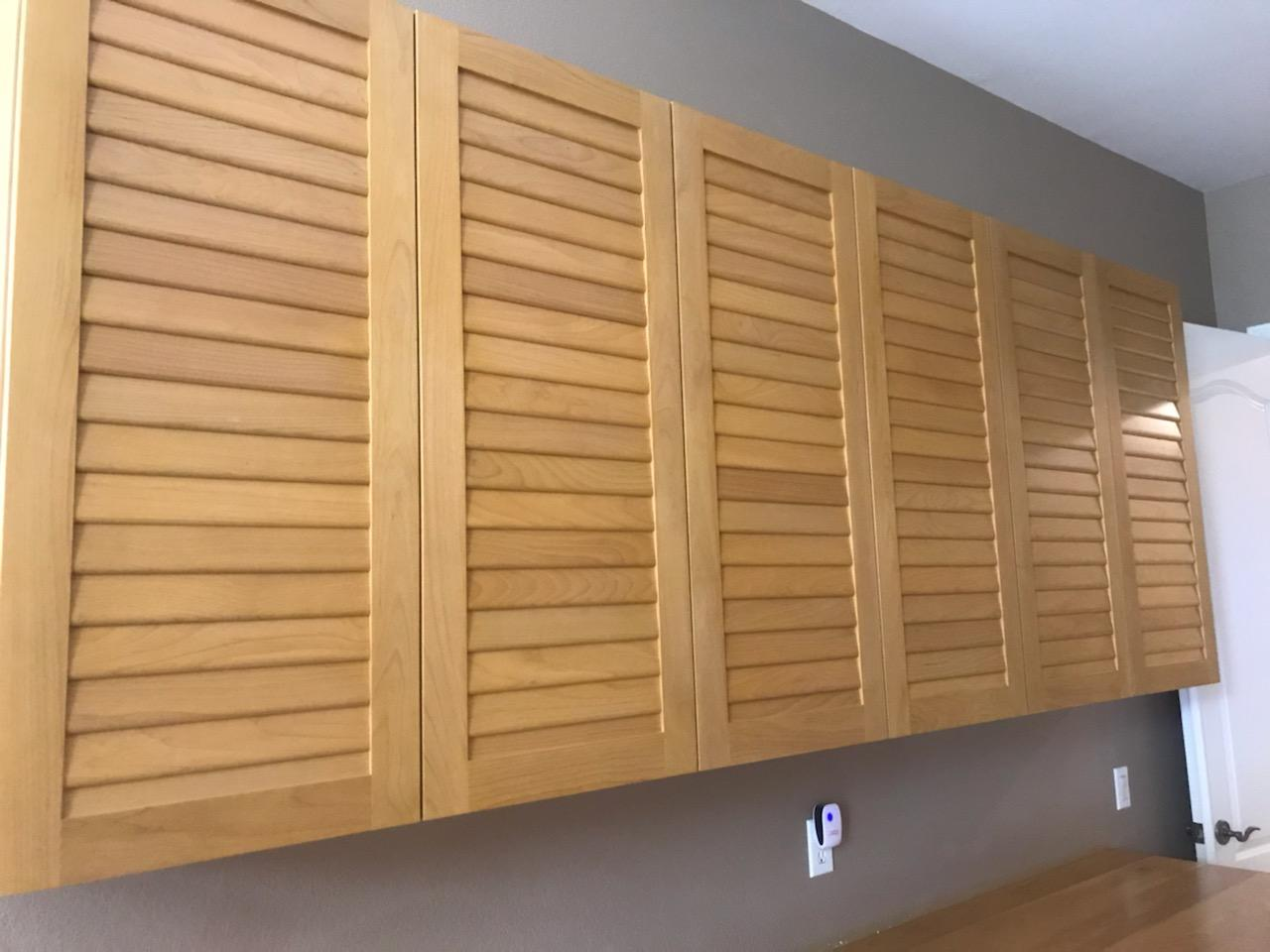Slatted cabinets with a hard wood finish
