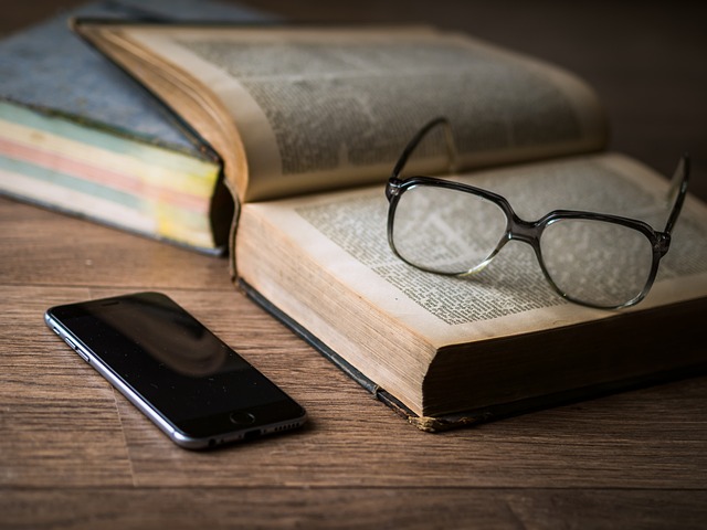 Book, glasses and phone