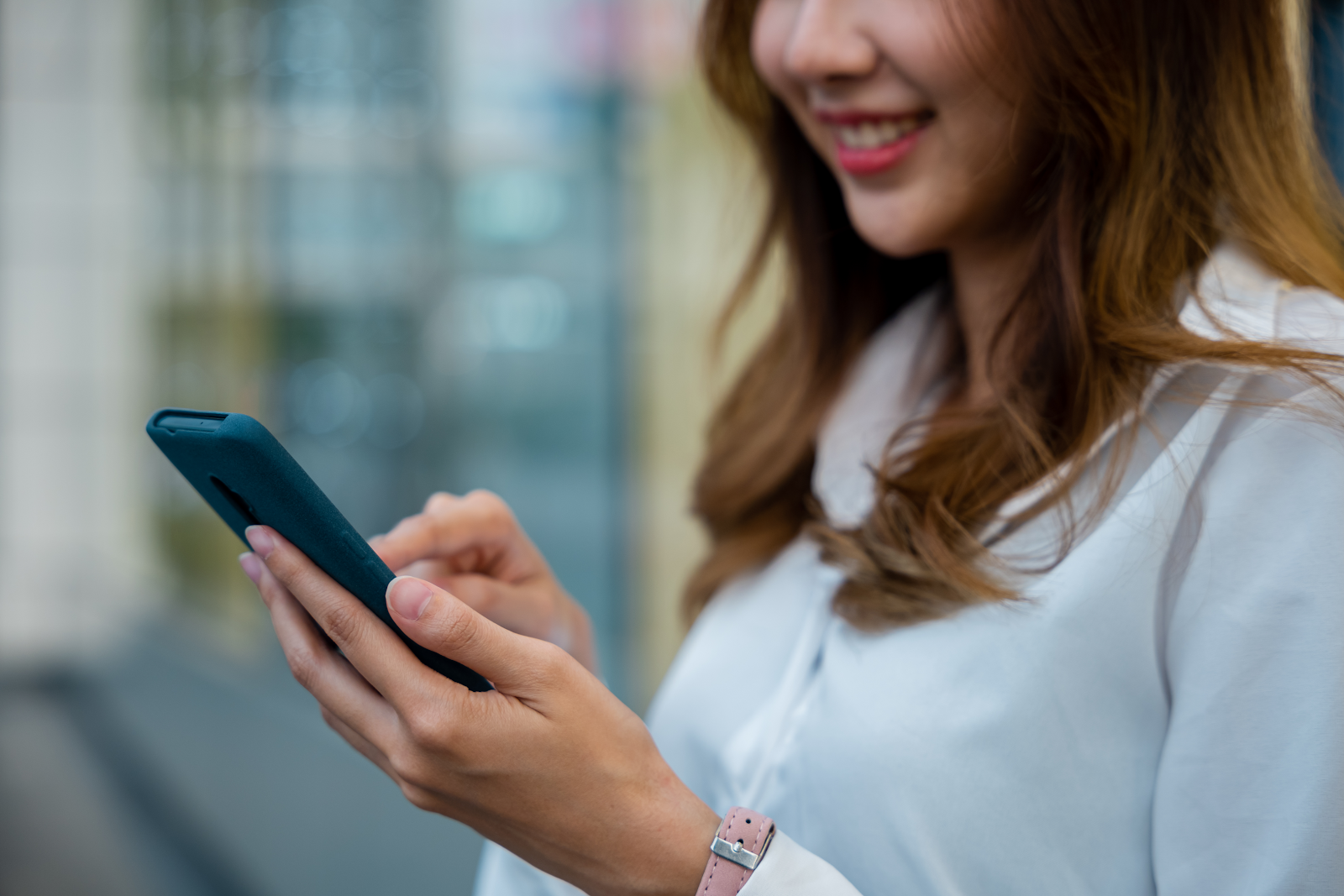 woman reading an SMS message