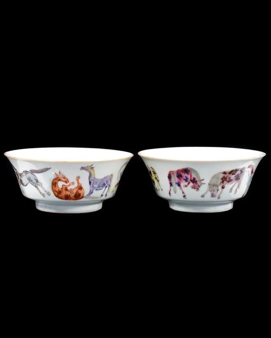 A pair of bowls with animals on themDescription automatically generated
