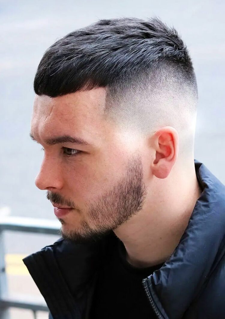 Side view of a guy rocking the mid fade crew  cut