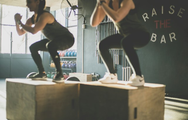 Women doing box jumps