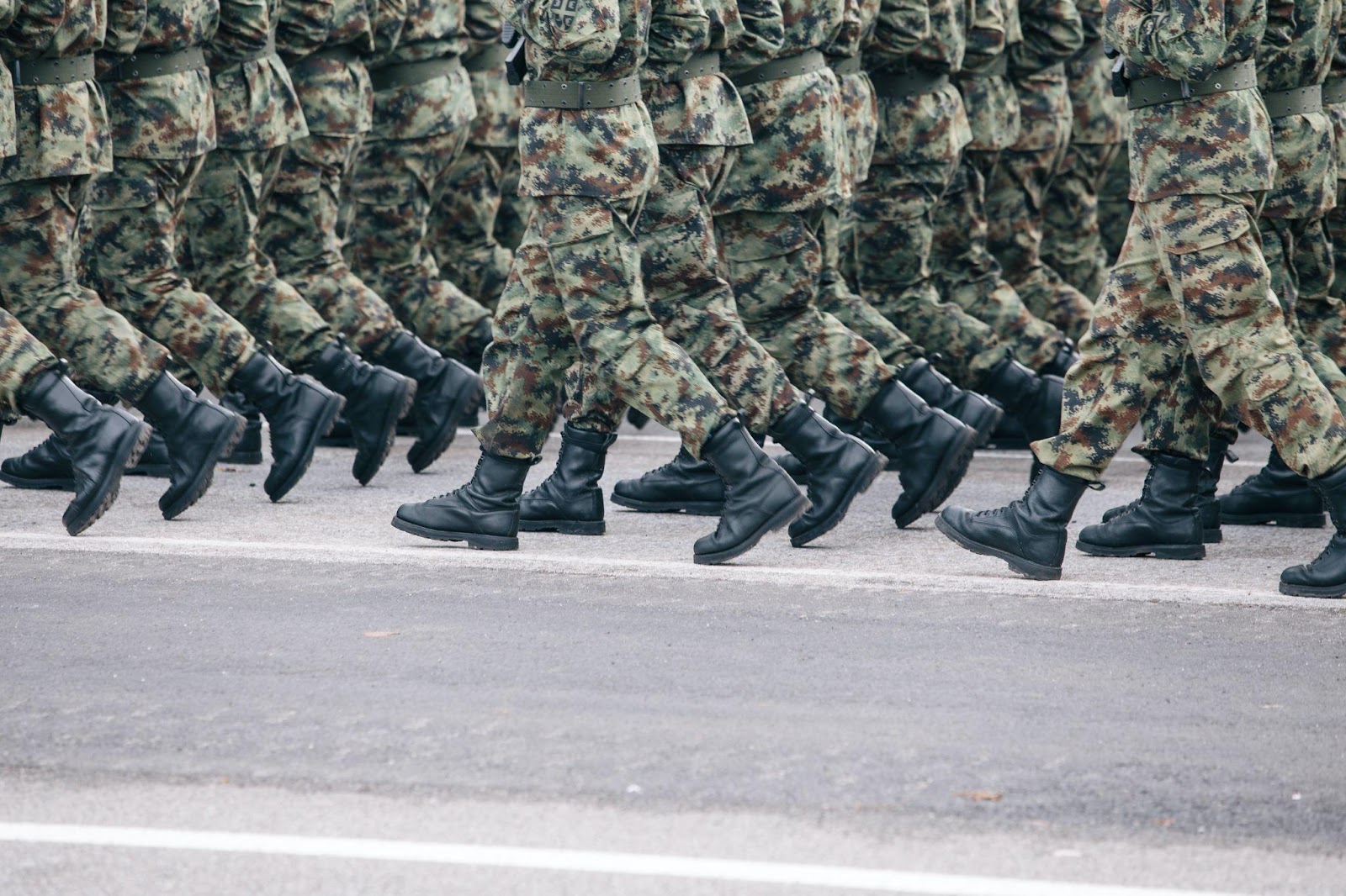 legs of military soldiers walking