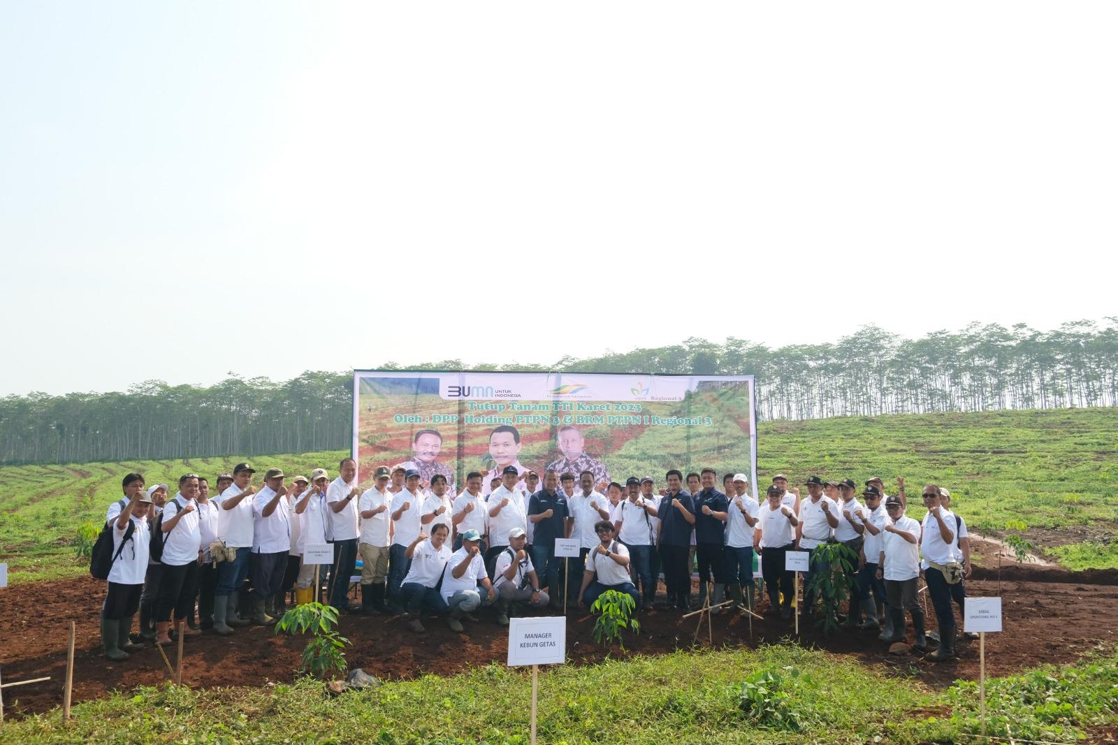 A group of people standing in front of a sign

Description automatically generated