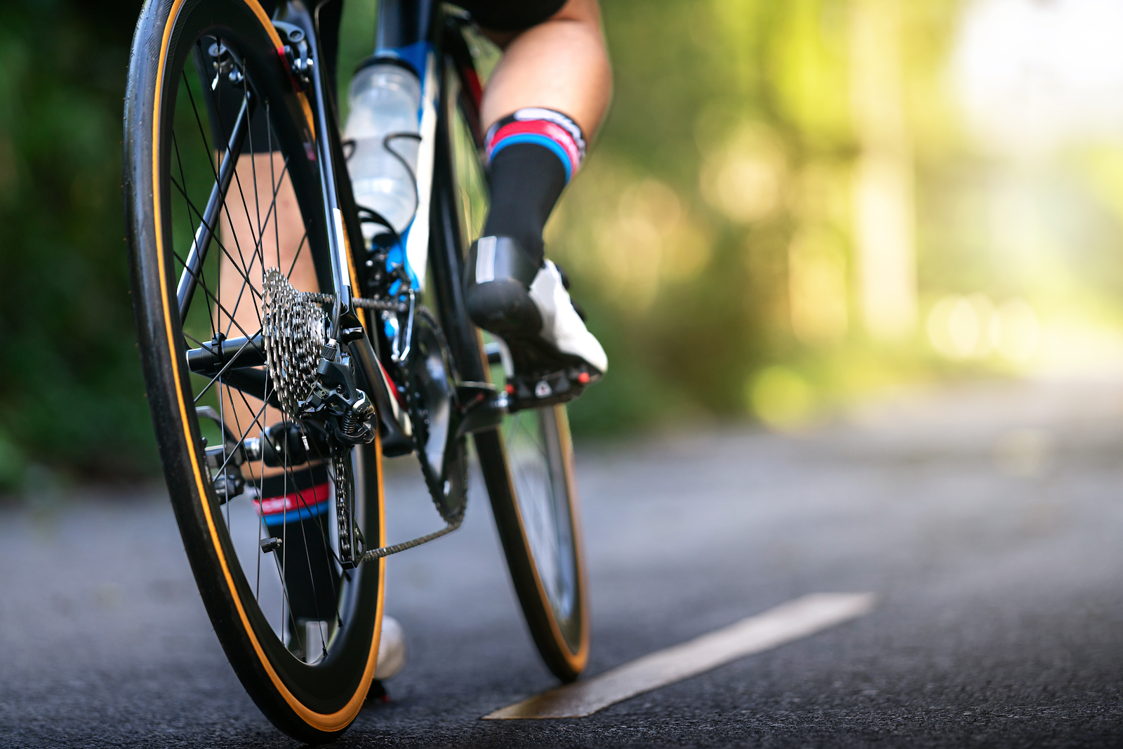 man riding on a bicycle in the middle of the road