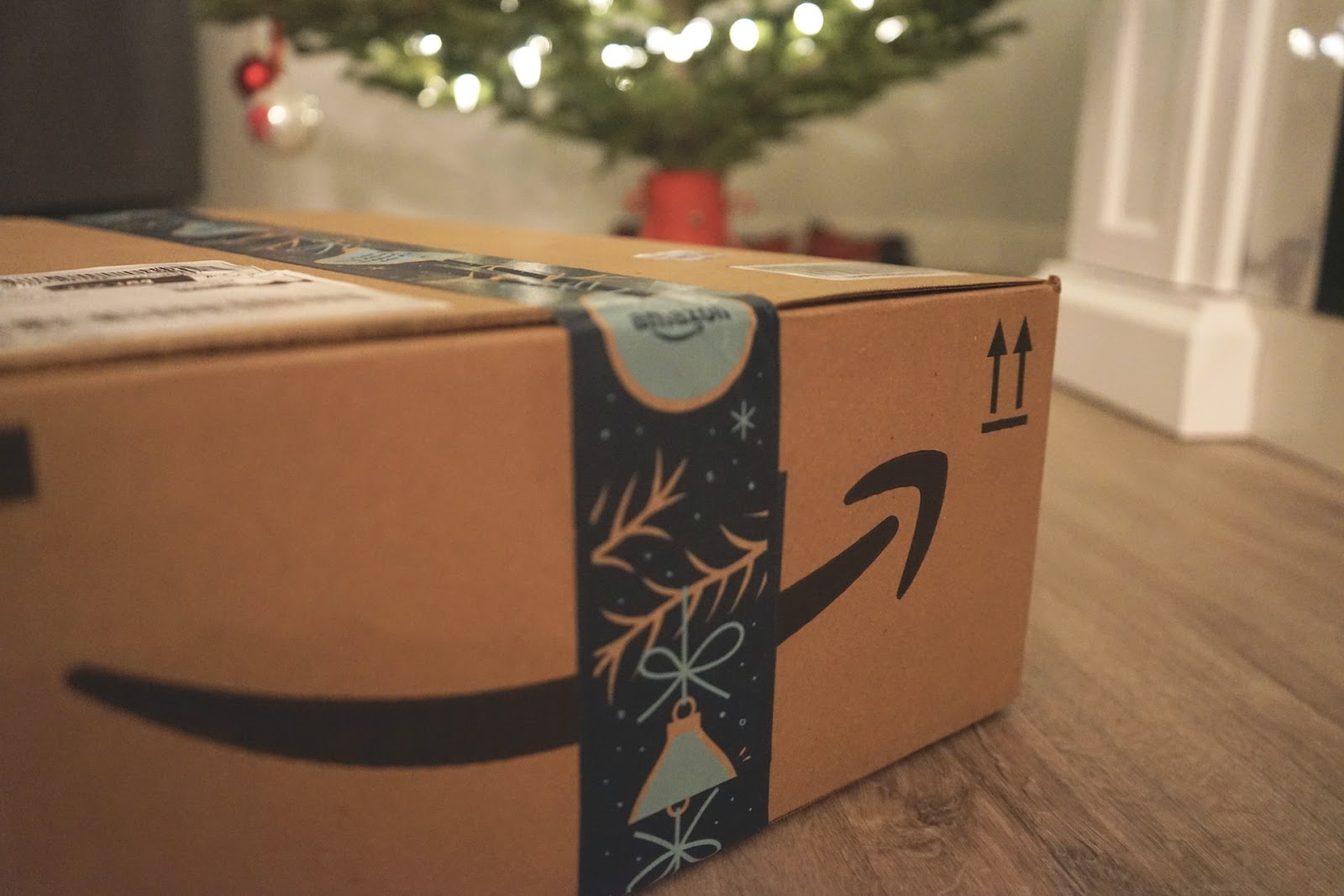 An amazon box under a christmas tree
