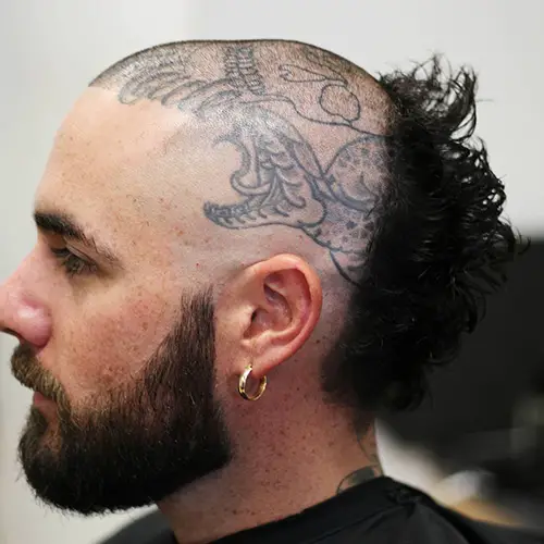 Picture of a man wearing the skullet hairstyles