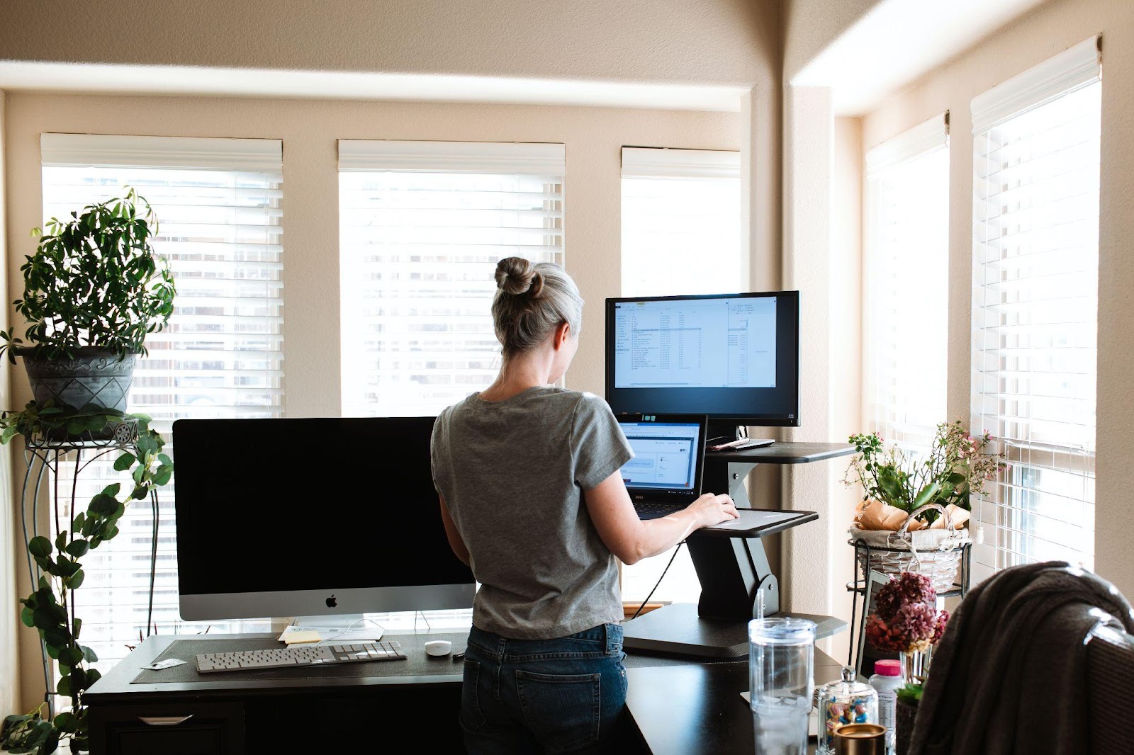 a person working with multiple monitors