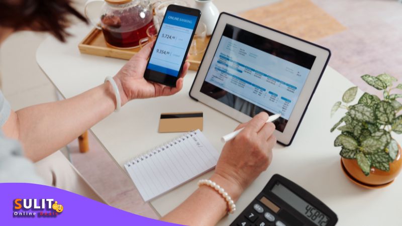 Woman using online payment methods on smartphone and tablet in the Philippines.