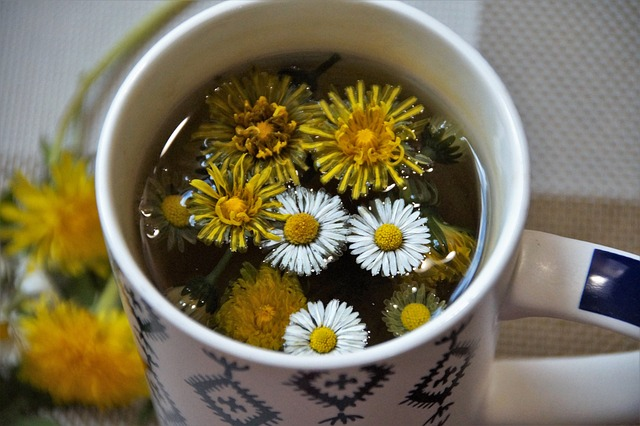 Herbal tea with dandelion in a cup.