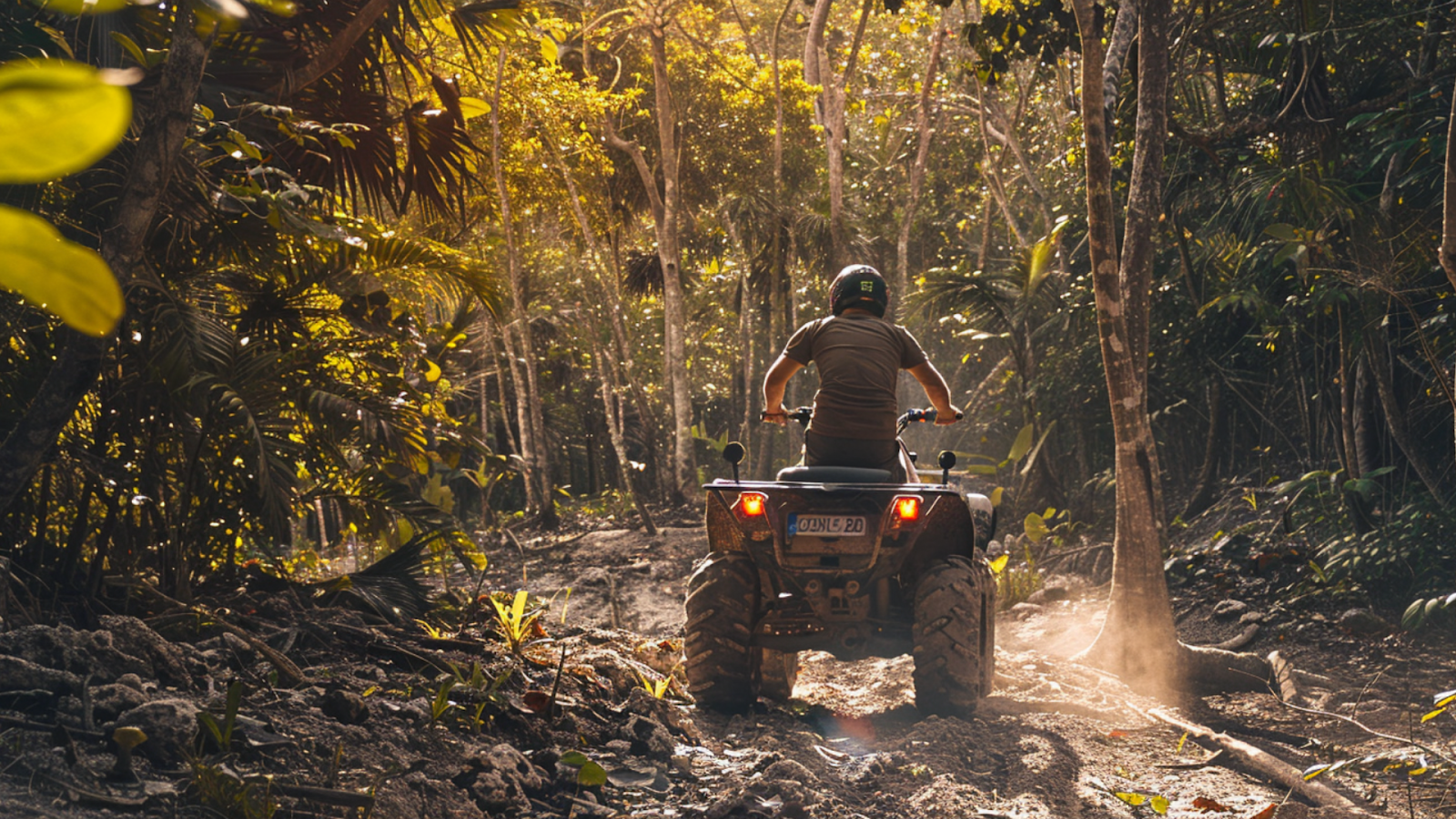 A man going on an ATV adventure exploring the lush jungles of Cancun