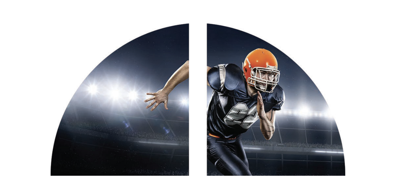 Jugador de fútbol con casco naranja bajo las luces de un estadio