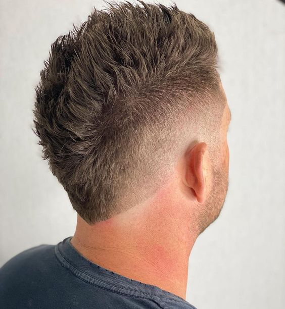Back view of a guy  wearing the faux hawk