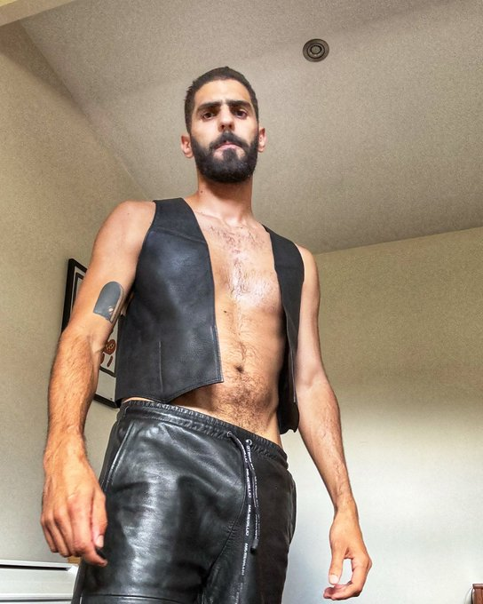 karim yoav wearing a leather vest shirtless and leather pants showing off his bulge 