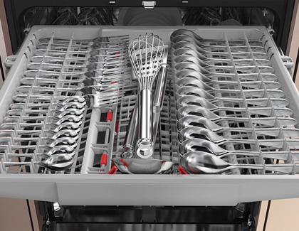 Samsung dishwasher with a rack full of metal spoons, forks, and other utensils