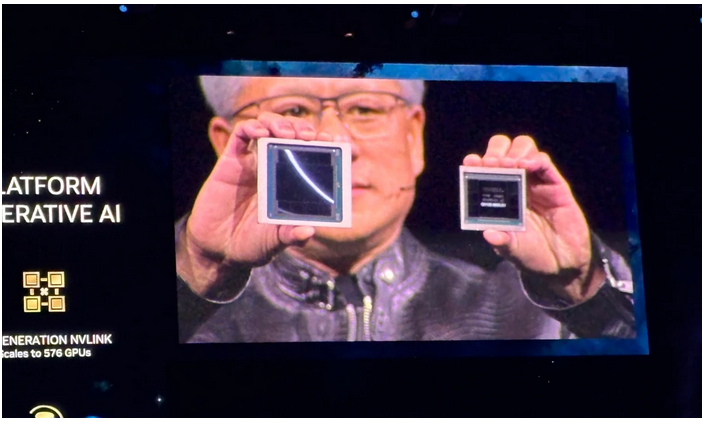 NVIDIA CEO Jensen Huang shows the Blackwell (left) and Hopper (right) GPUs at NVIDIA GTC 2024 in San Jose, California on March 18. 
