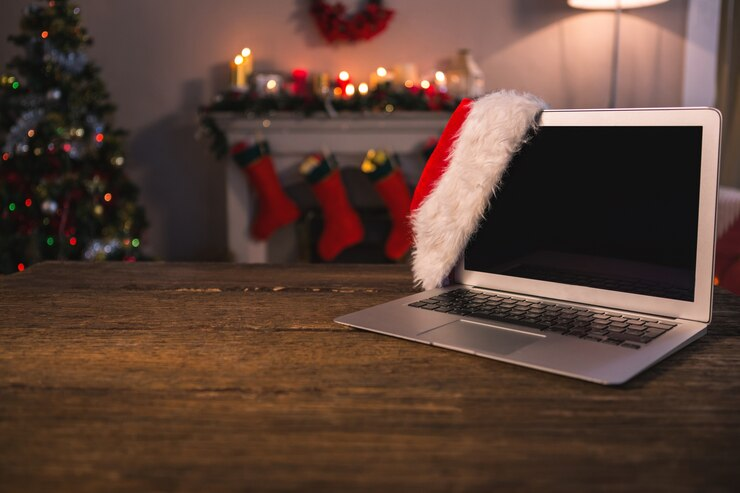 Festive laptop with Santa hat – ideal study setup for holiday revising.