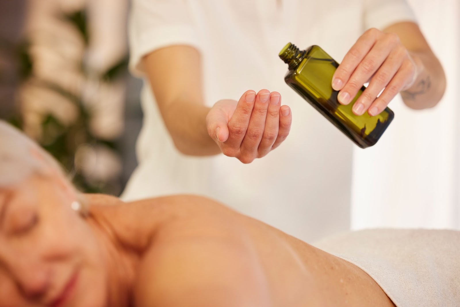 A woman receiving a massage with "massage therapy", Relaxation and rejuvenation at a spa.