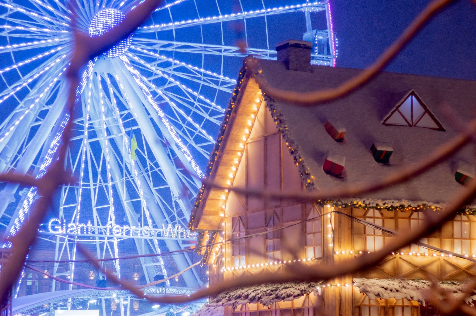 Quaint European Christmas market with festive decorations and twinkling lights.