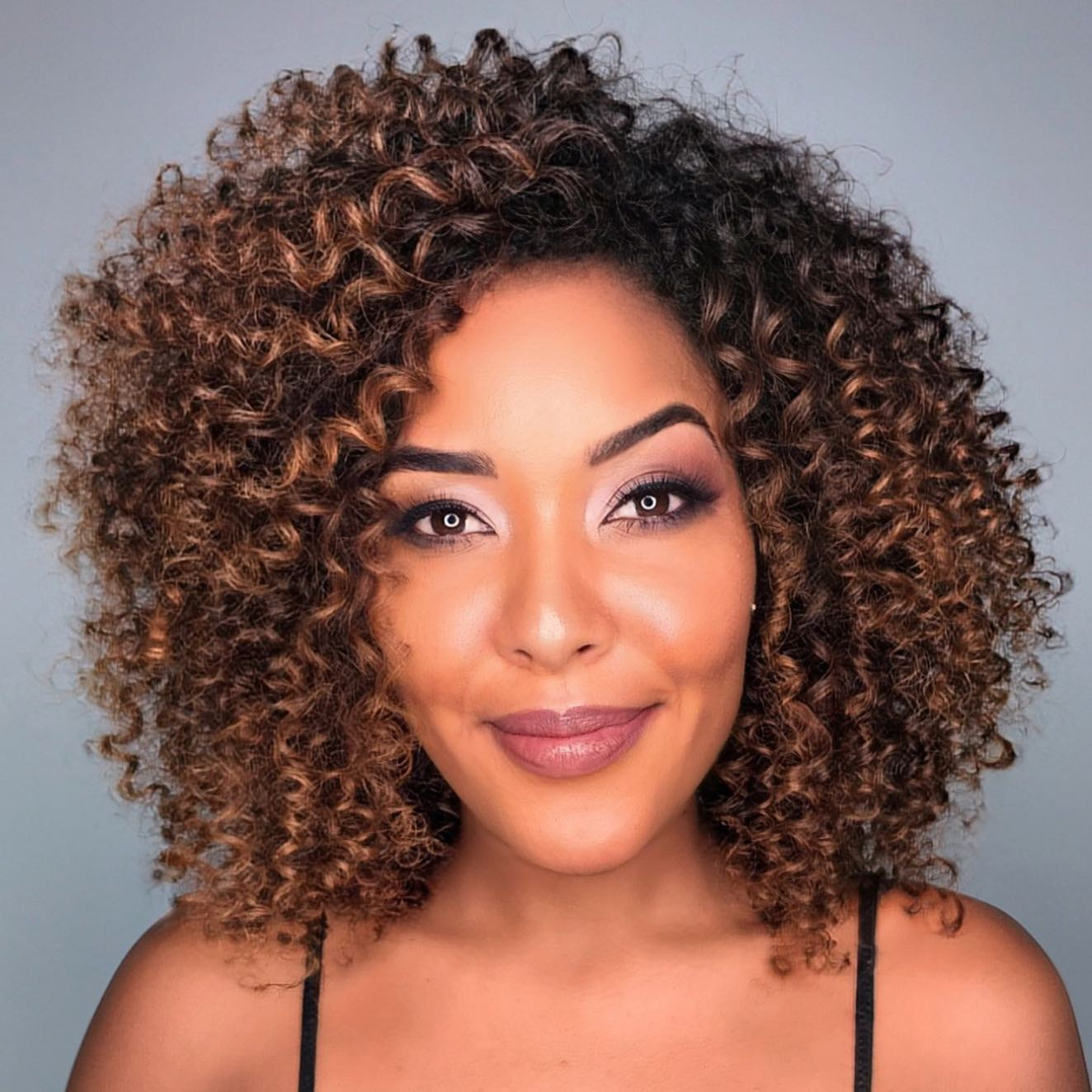 Natural Curls with Caramel Highlights
