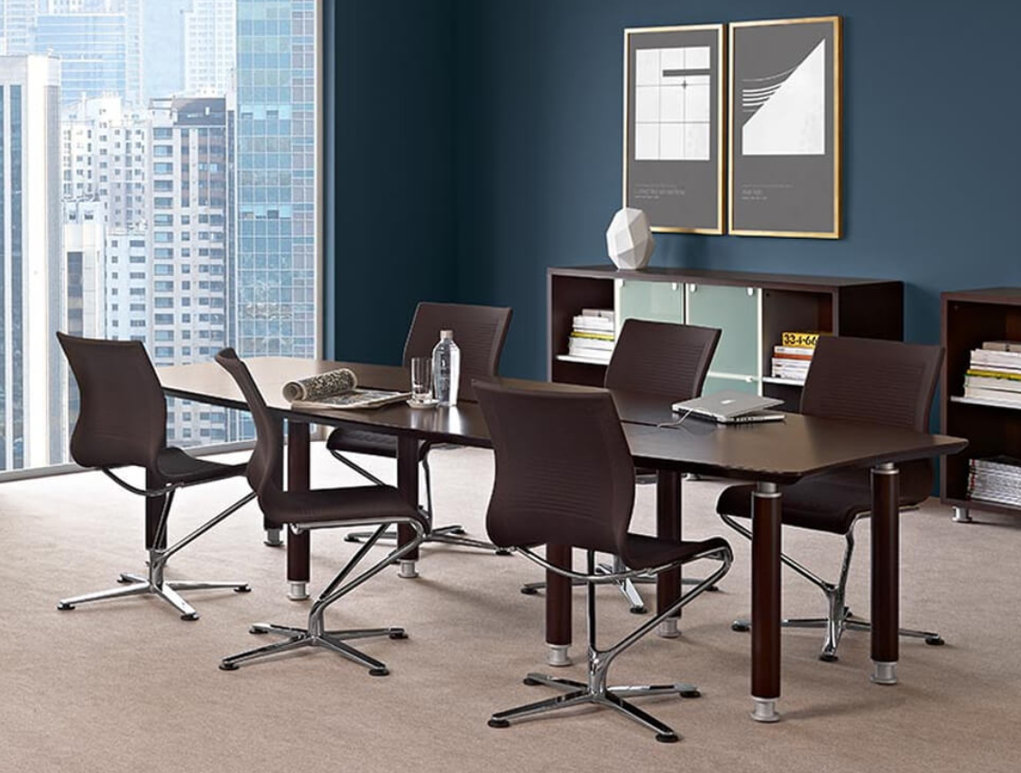 Brown rectangular meeting table
