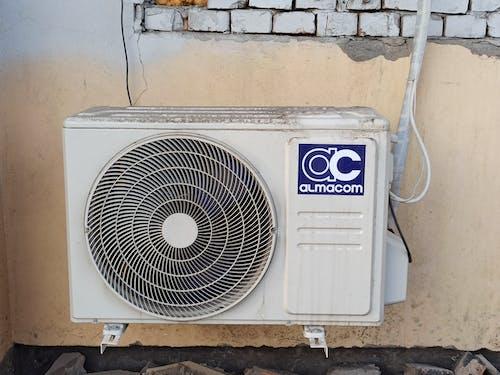 Free Air Conditioner Unit on a Wall Stock Photo