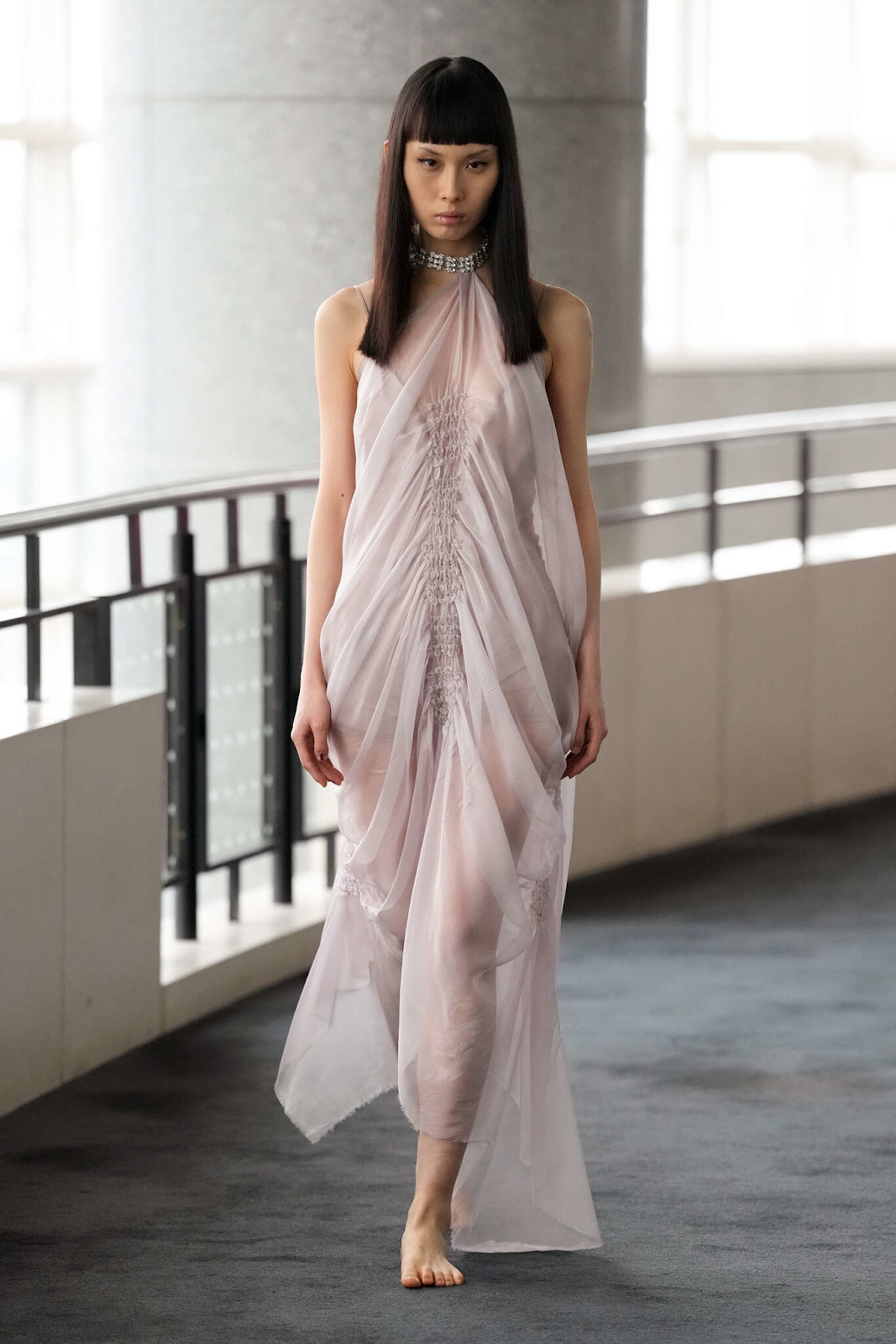Picture of  another model in a sheer gown for the AELIS Haute  Couture  SS24