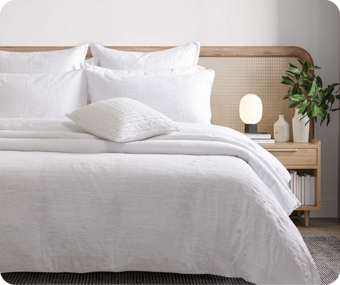 Our white Chalkstone Duvet Cover shown on a bed.