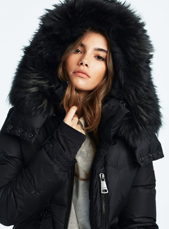 Picture of a model layering her moose knuckles coat