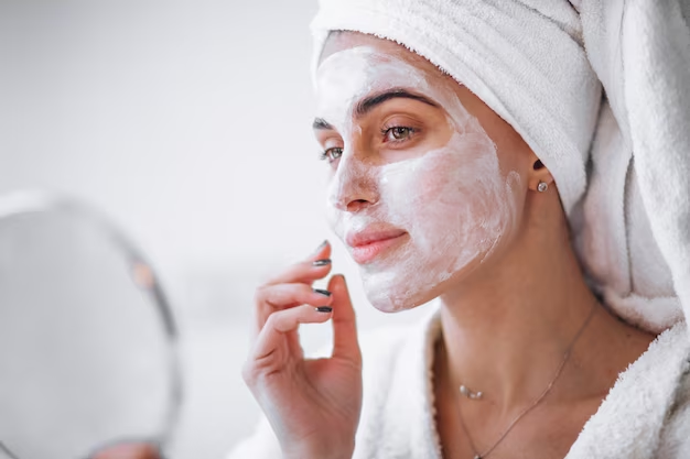 Woman With a Face Mask and Hair in a Towel