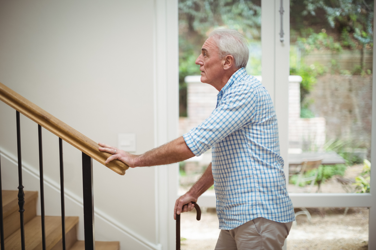 Senior walking up the stairs