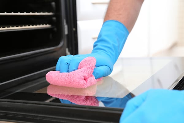 wiping the oven 