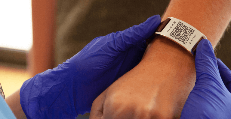 A medical QR Code on a bracelet, containing personal health information.