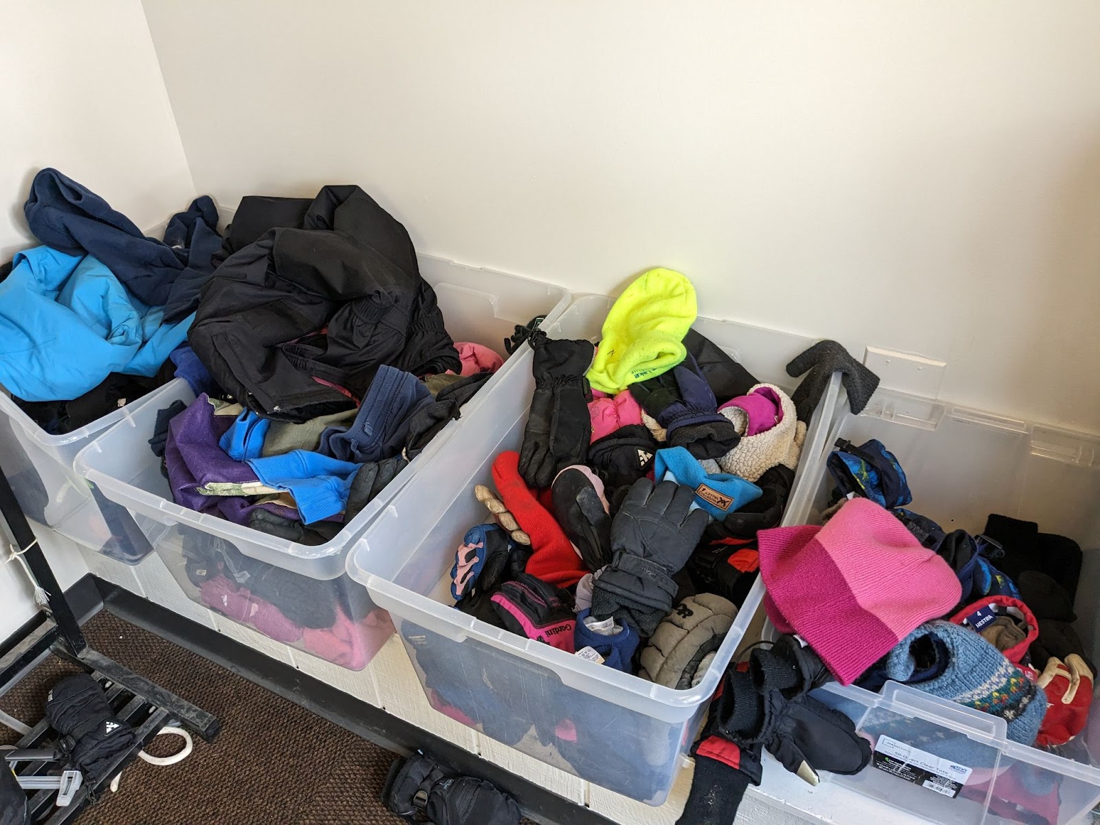 Image of items in lost and found, gloves and hats