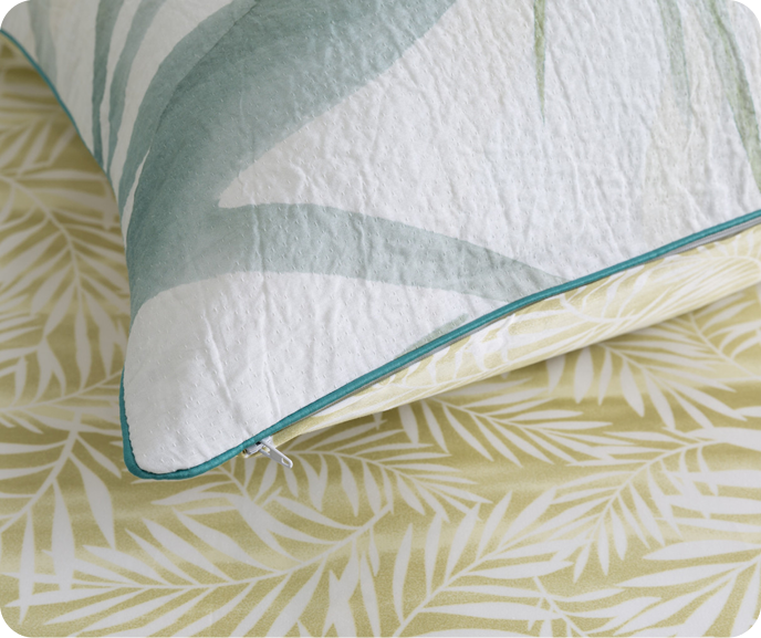 A close up shot of our Botanical Bonita Pillow Sham with its reverse pattern showing.