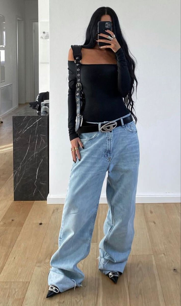 Full picture of a lady rocking the empyre pants with black top