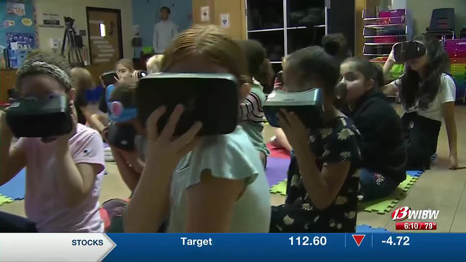 Children wearing virtual reality headsets. 
